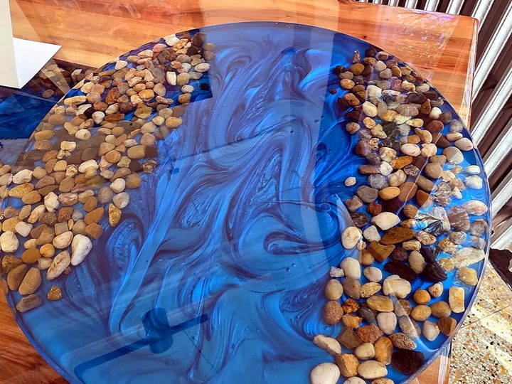 A close-up of a handmade resin table piece, the kind of work you'd find at a makers market.